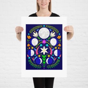Celestial Phases: Folk Art Style Lunar Phase Art Print is held up by a model in front of a white painted brick wall