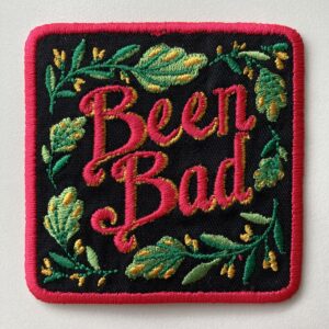 Hand-lettered Been Bad Embroidered Patch on a white table